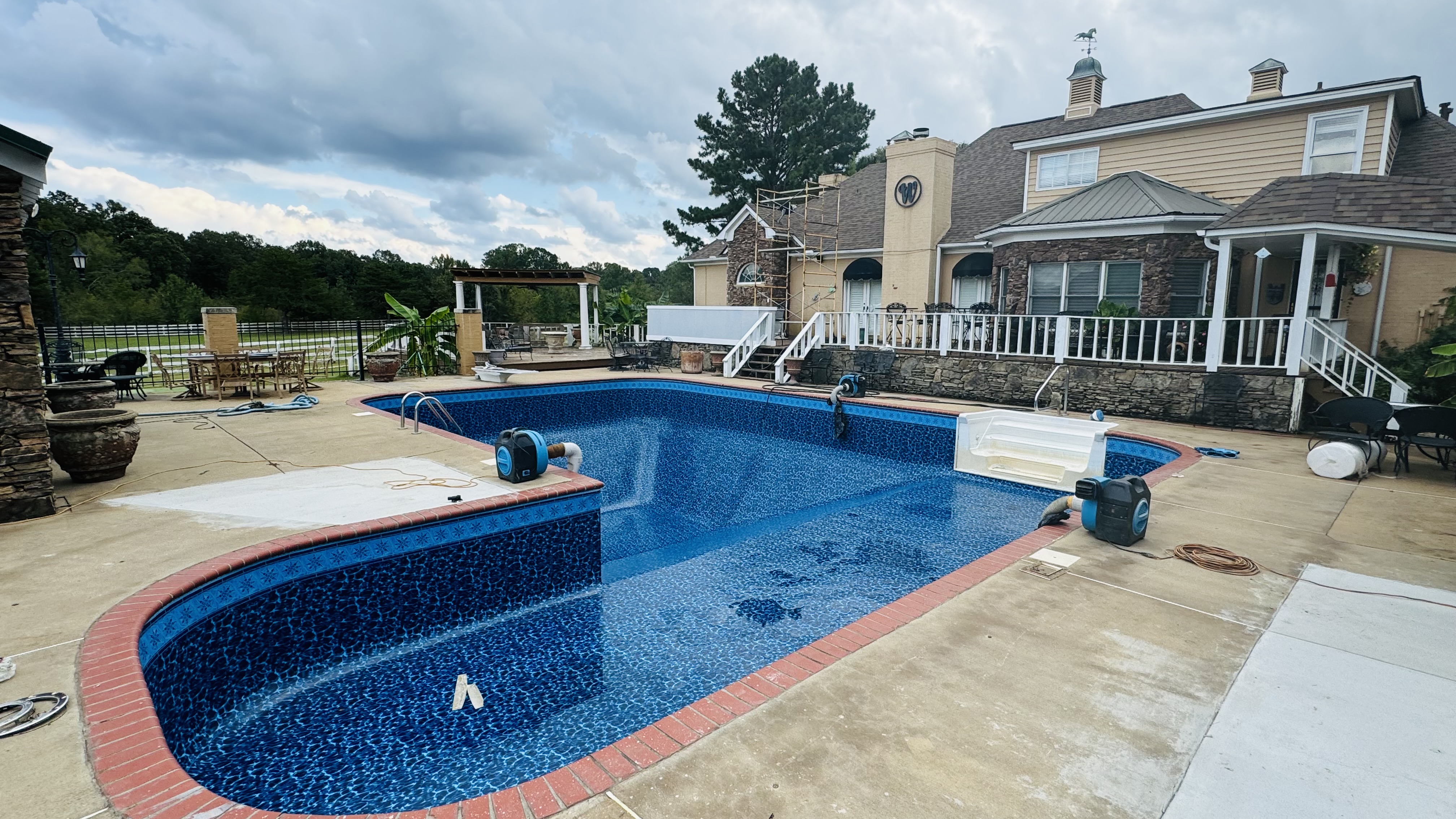Completed blue vinyl liner installation by Artesian Pools